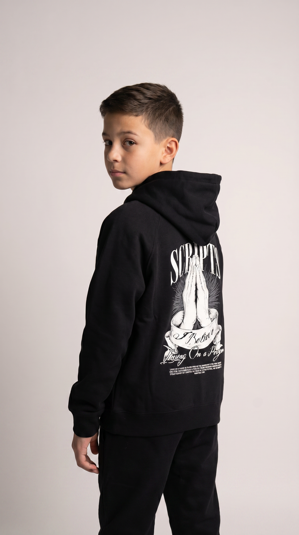 Christian youth hoodie with praying hands graphic and "I Believe, Living on a Prayer" design