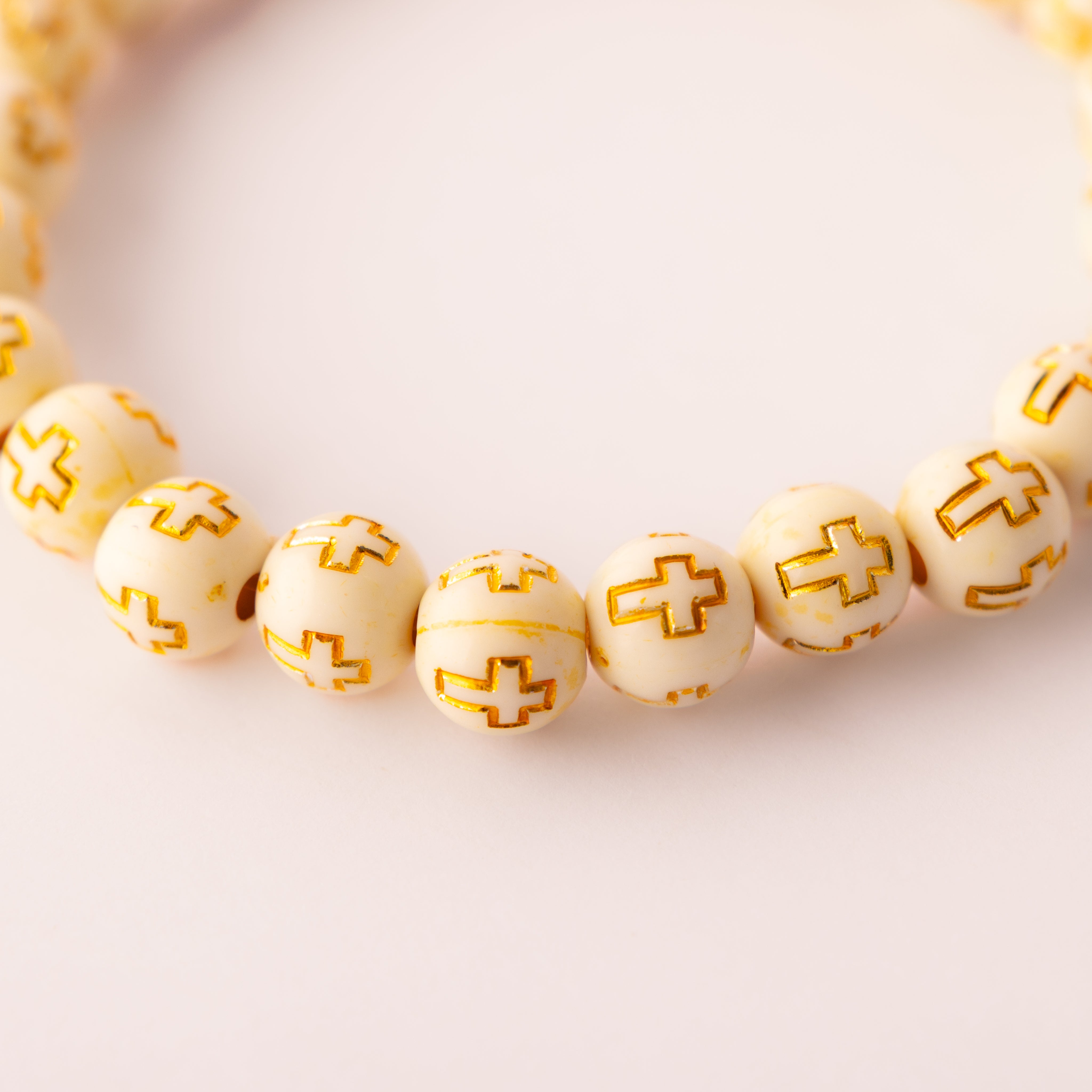 Golden Grace acrylic cross bead bracelet - close-up of cross beads