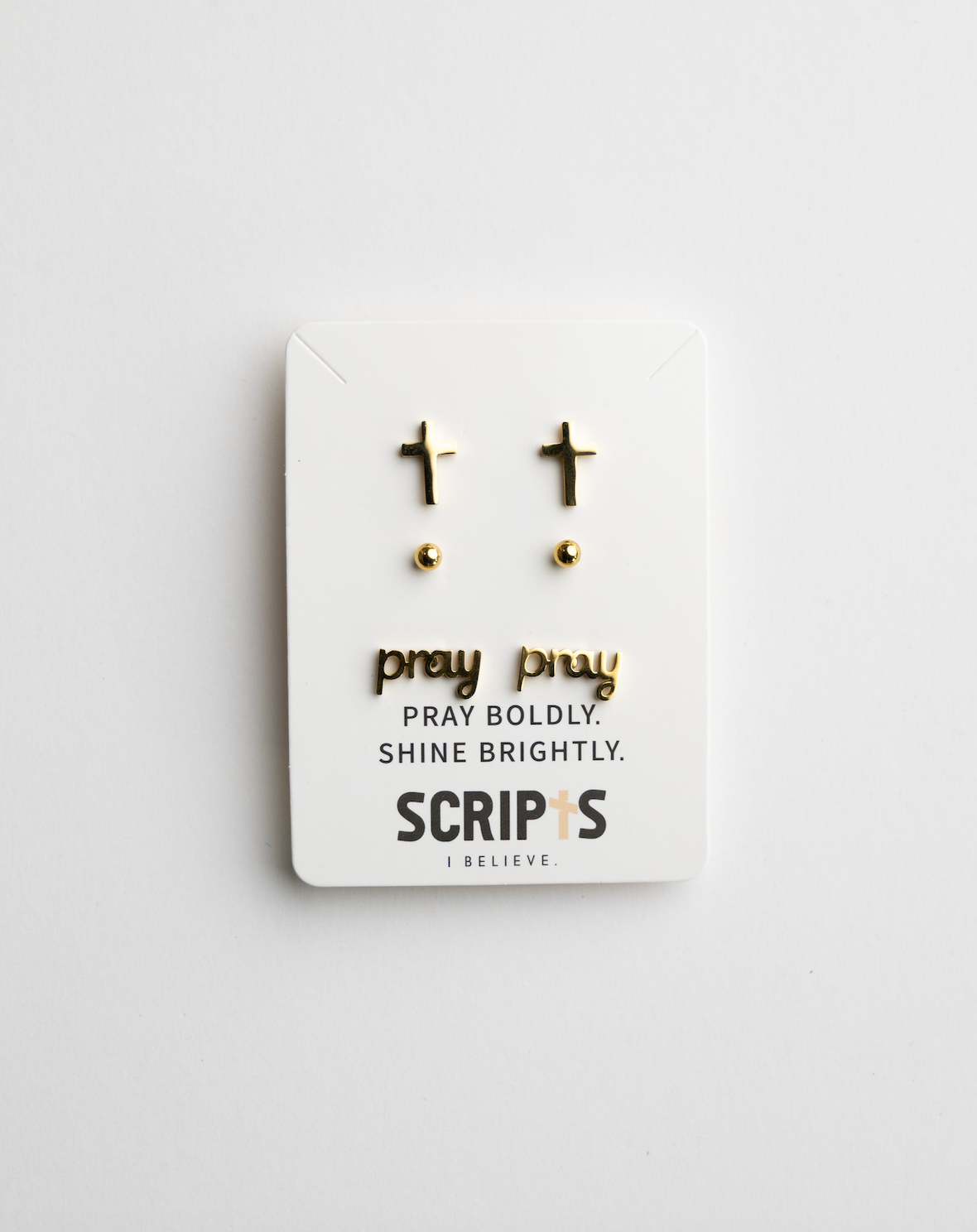 Gold Christian "Pray" cross stud earrings on display card