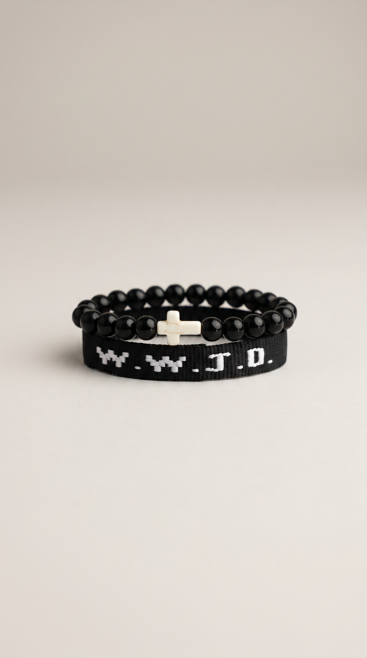 Black WWJD beaded bracelet with cross charm - close-up