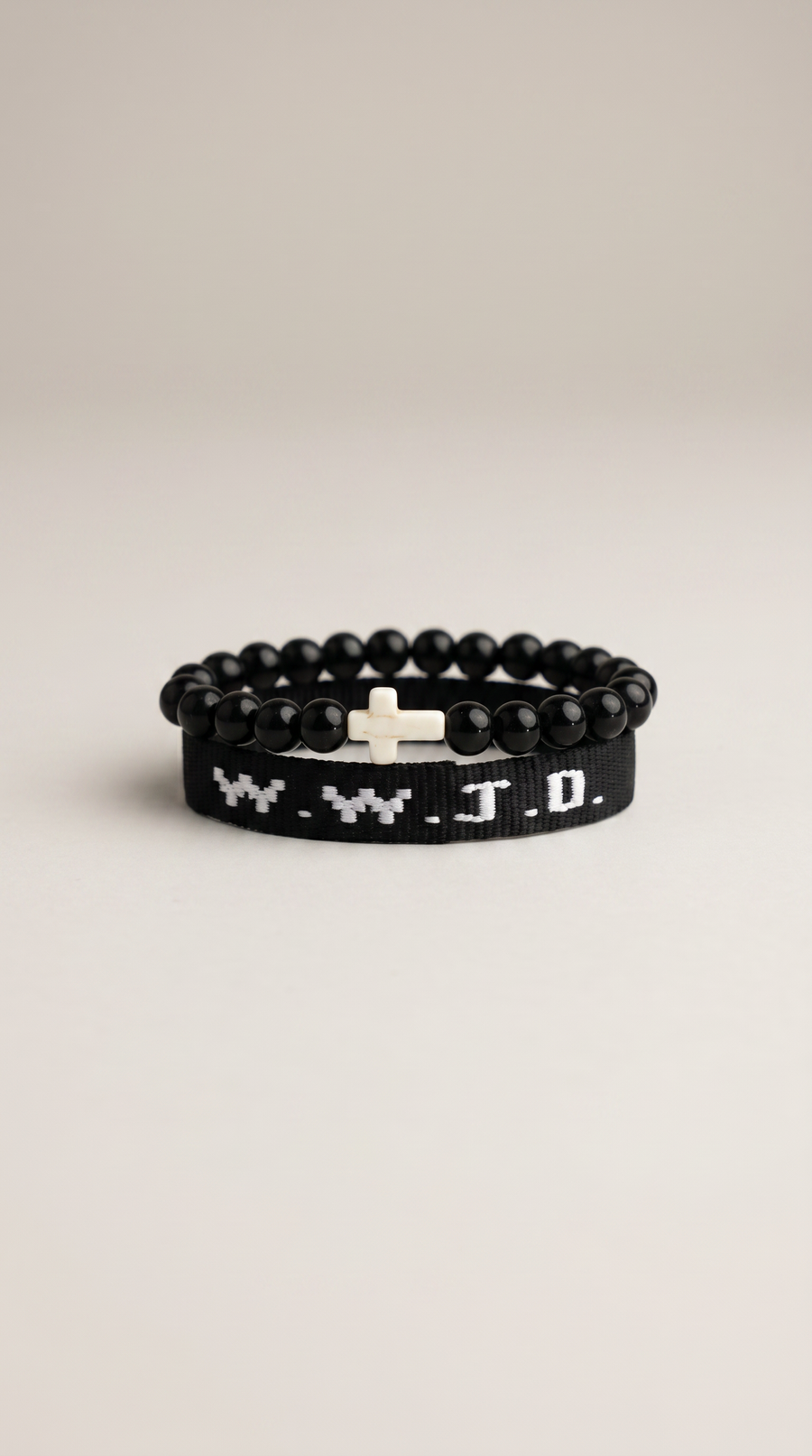 Black WWJD beaded bracelet with cross charm - close-up