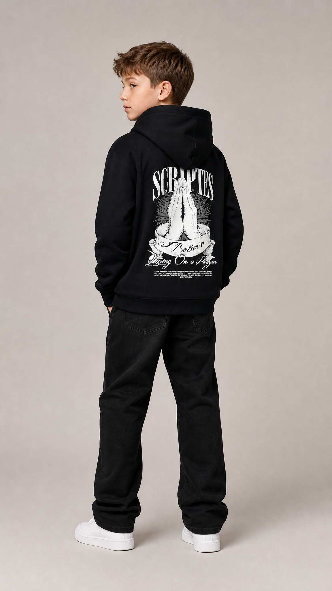 Christian youth hoodie - front view of boy wearing black "I Believe, Living on a Prayer" hoodie
