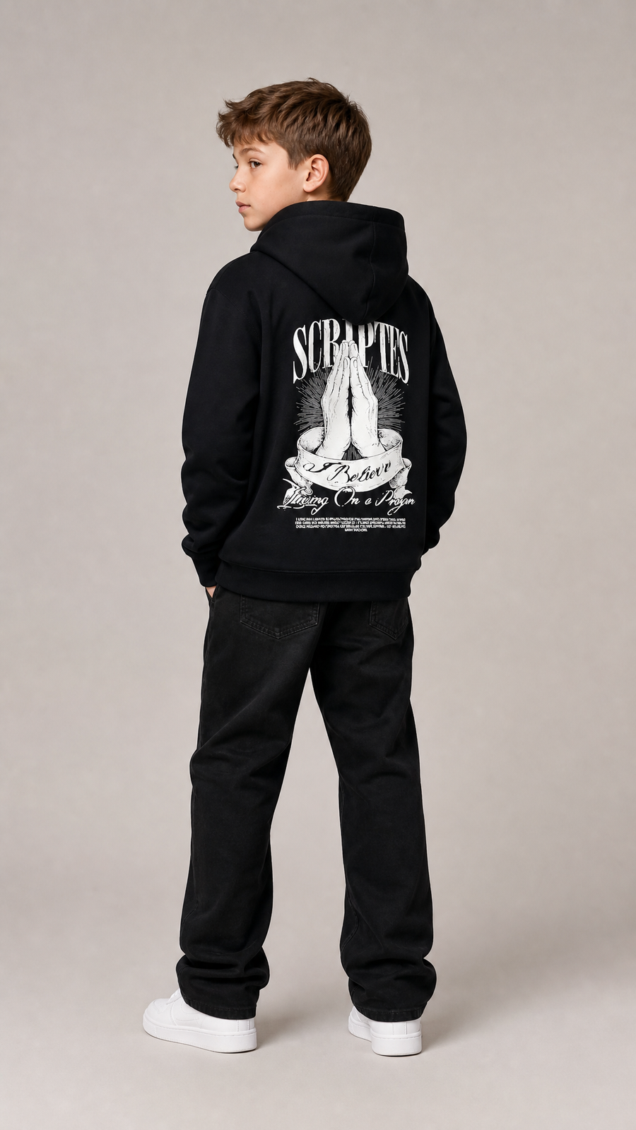 Christian youth hoodie - front view of boy wearing black "I Believe, Living on a Prayer" hoodie
