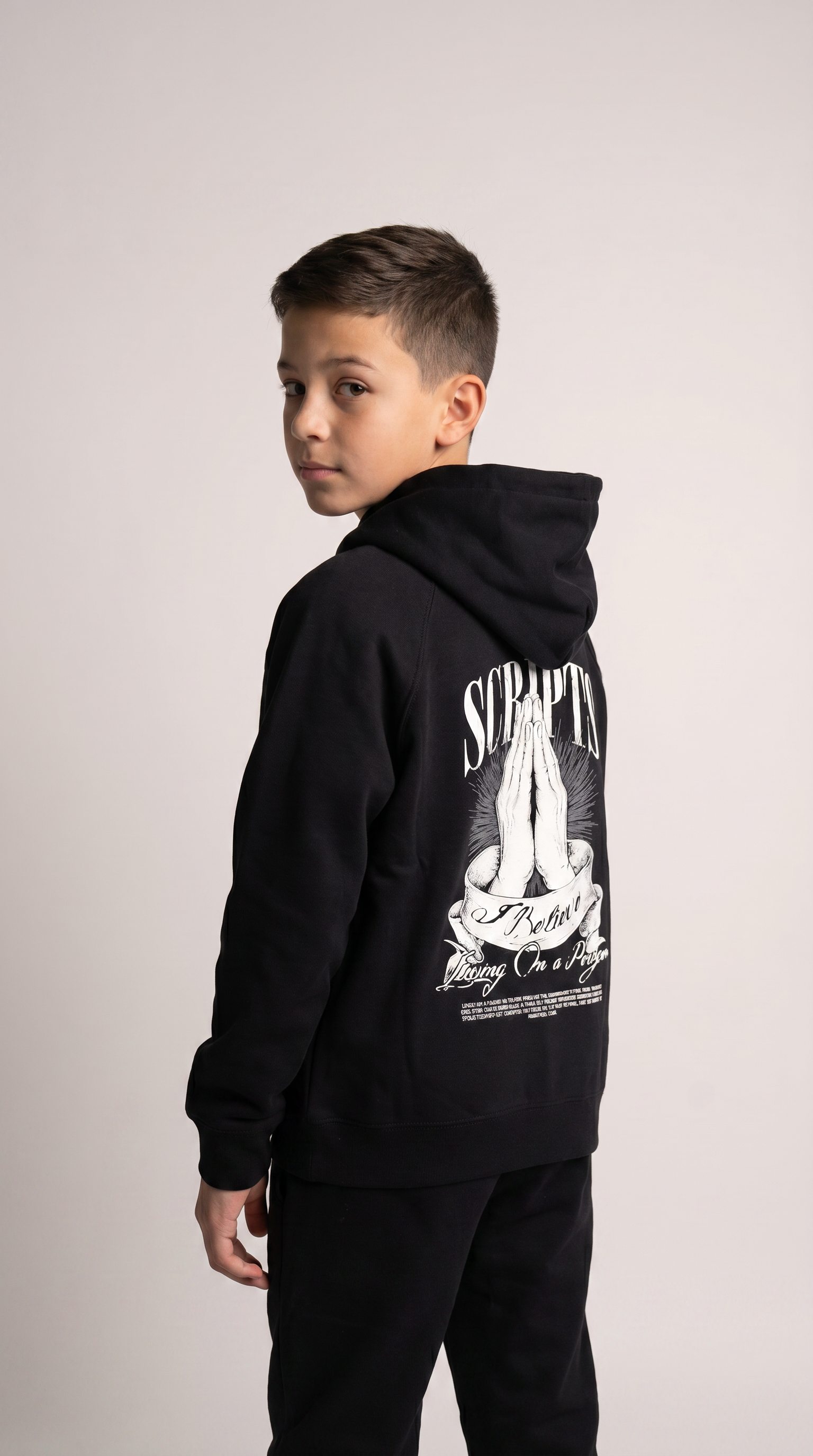 Christian youth hoodie with praying hands graphic and "I Believe, Living on a Prayer" design