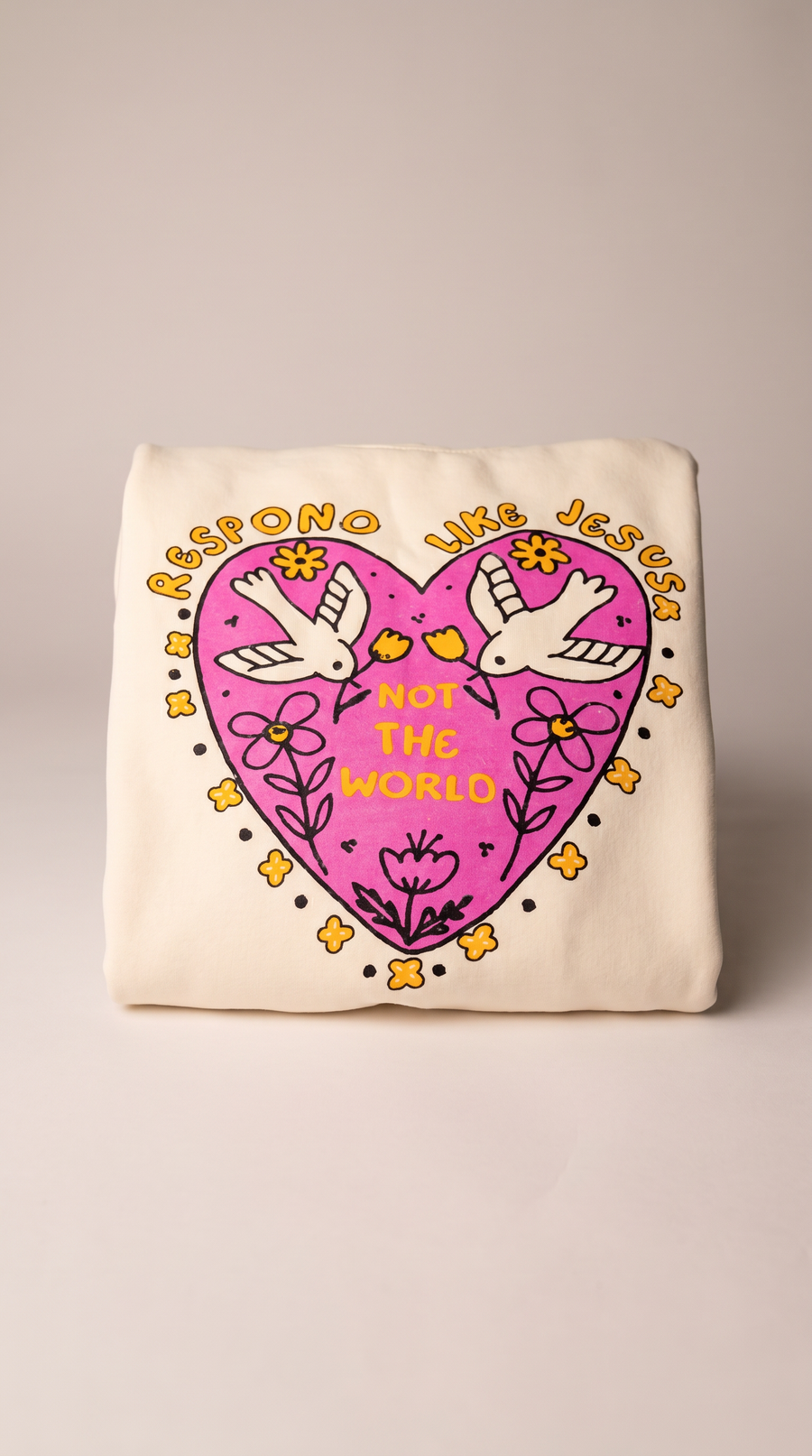 Christian youth hoodie with pink heart graphic "Respond Like Jesus, For the World" and dove design
