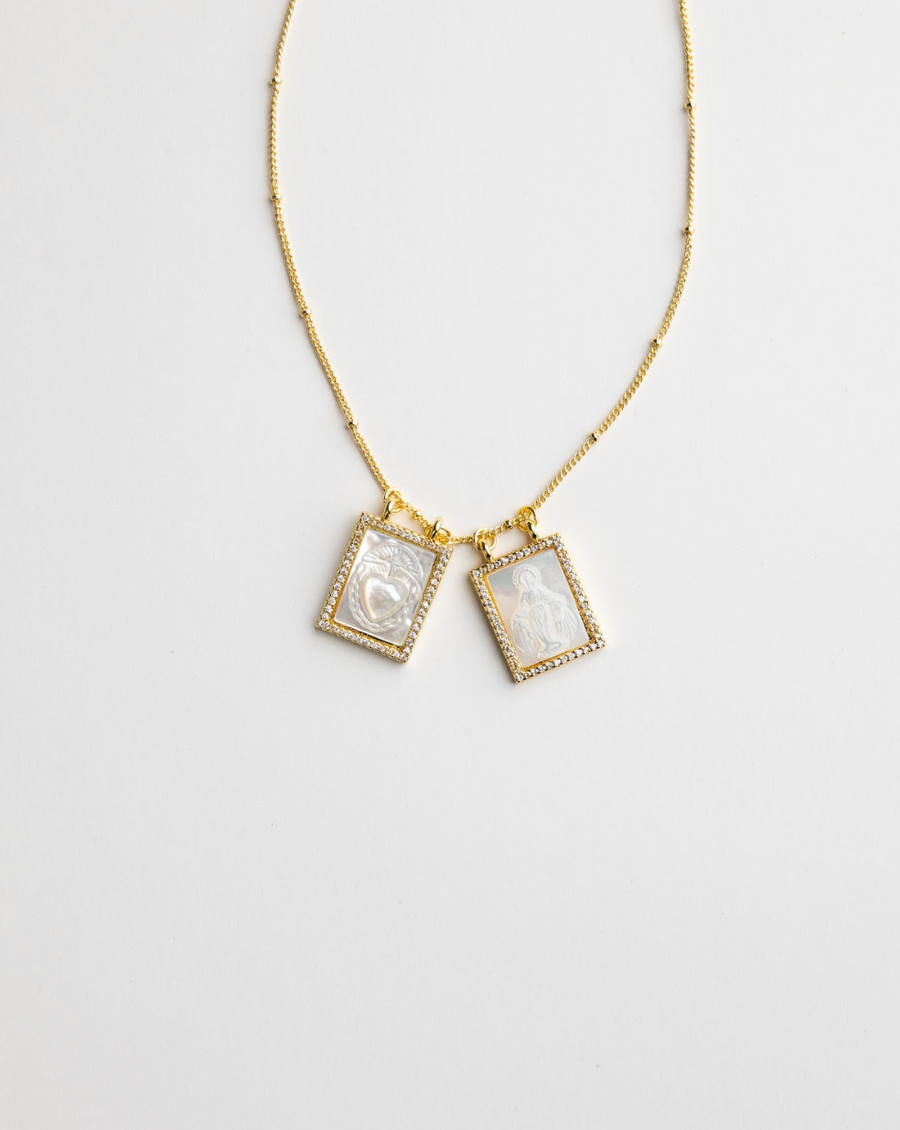 Gold Christian scapular necklace with shell-face pendant detail