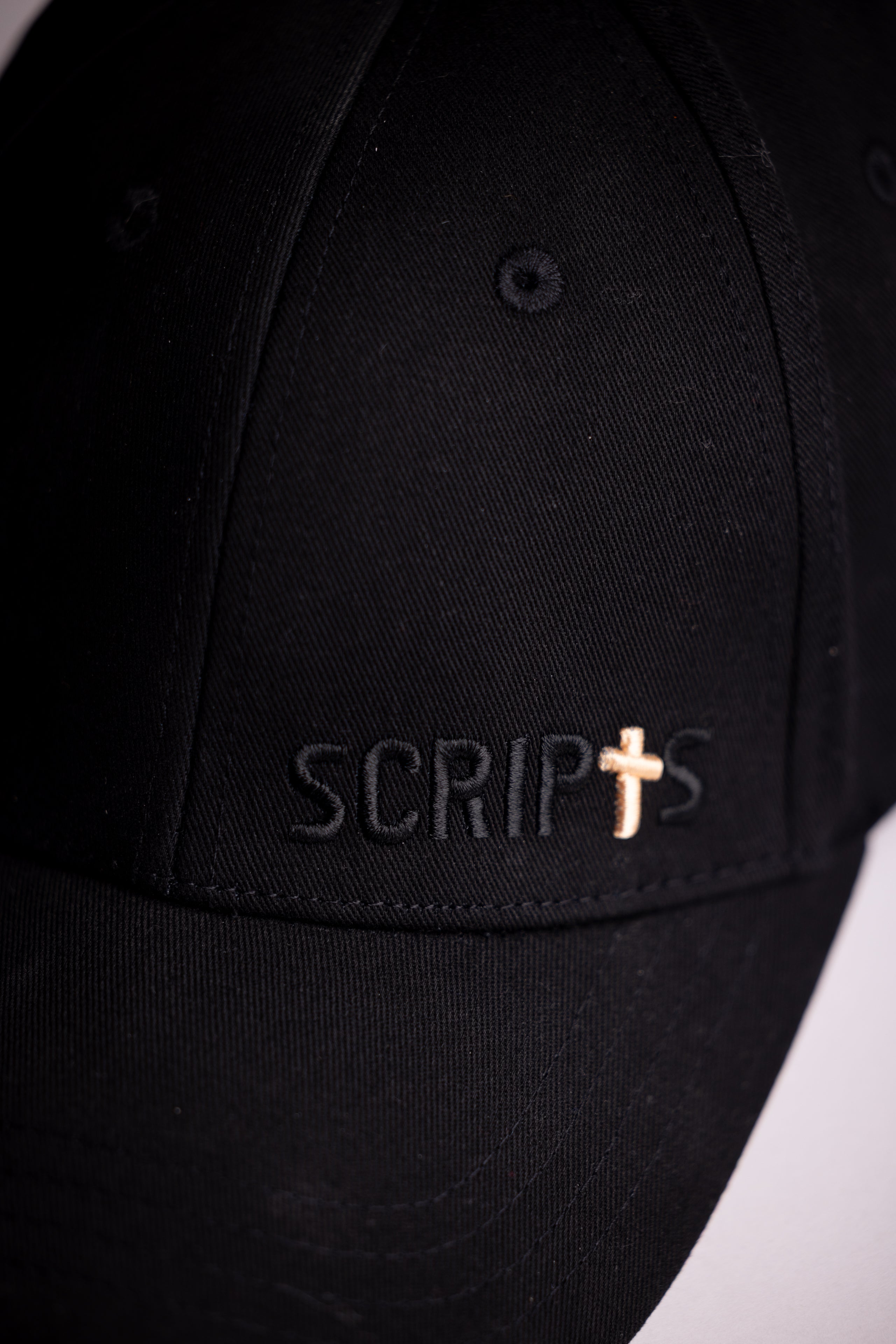Black Christian baseball cap with SCRIPTS logo and cross - front view