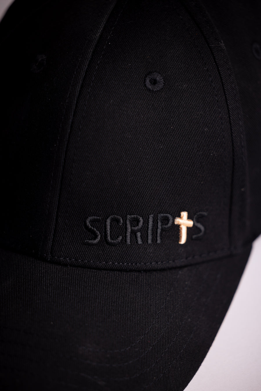 Black Christian baseball cap with SCRIPTS logo and cross - front view