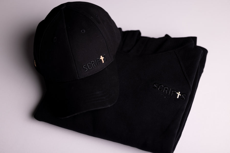 Black "I Believe" Christian cap - flat lay product shot