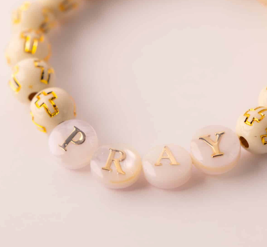 Pray Golden Grace cross bead bracelet - close-up