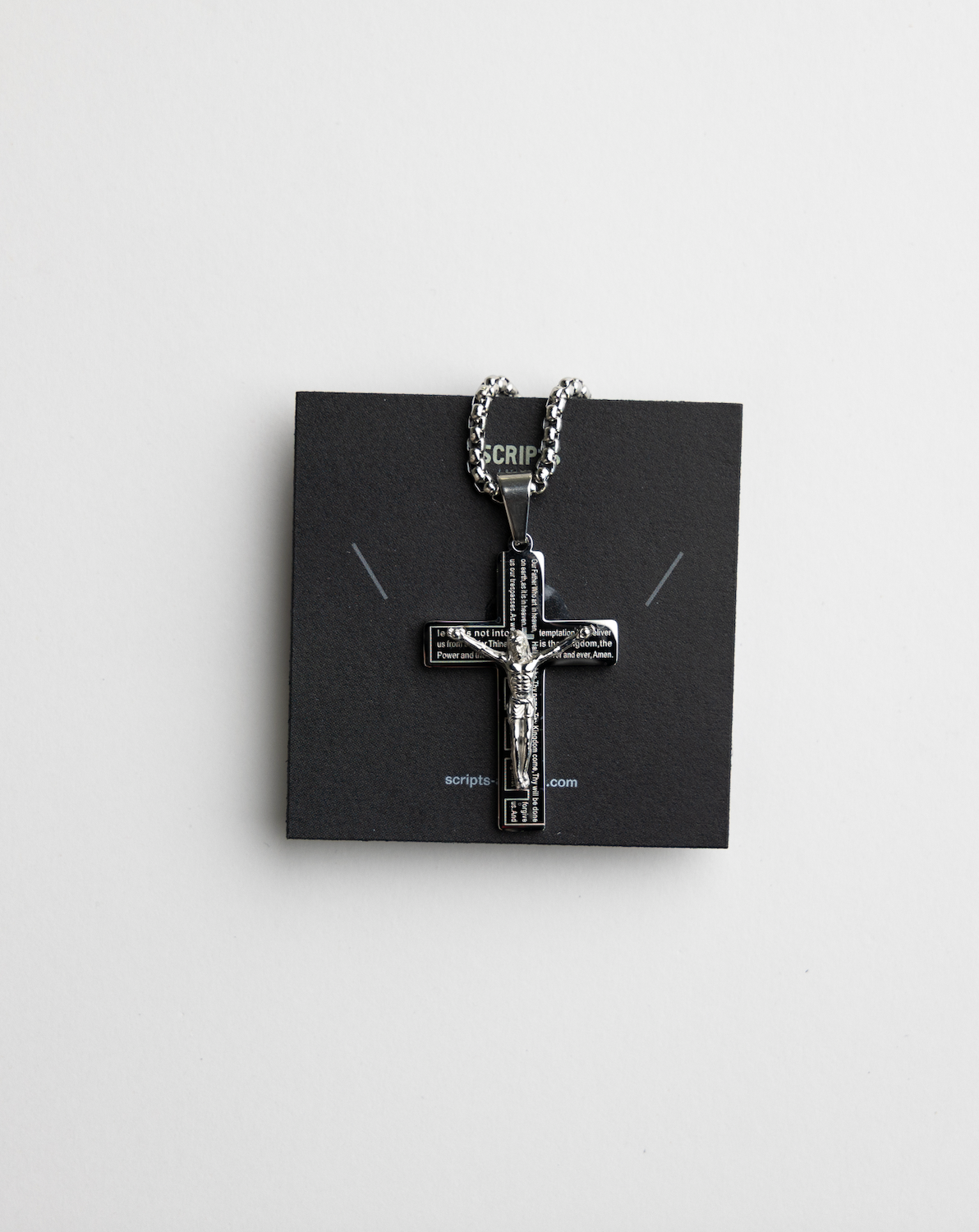 Christian crucifix pendant necklace - close-up on display card